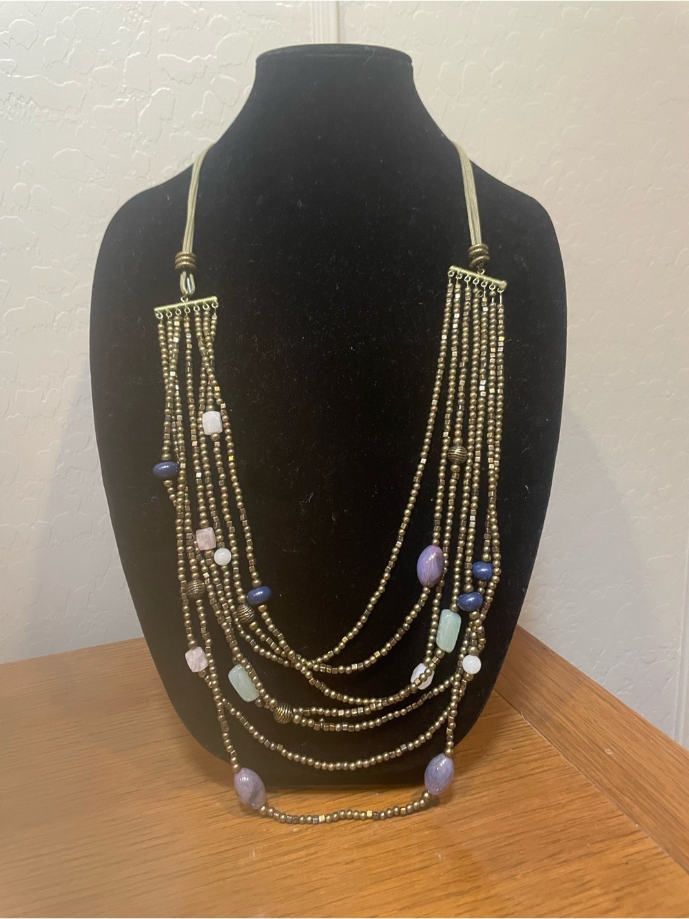 Multi-Strand Gold Bead Necklace with Purple and Blue Accents